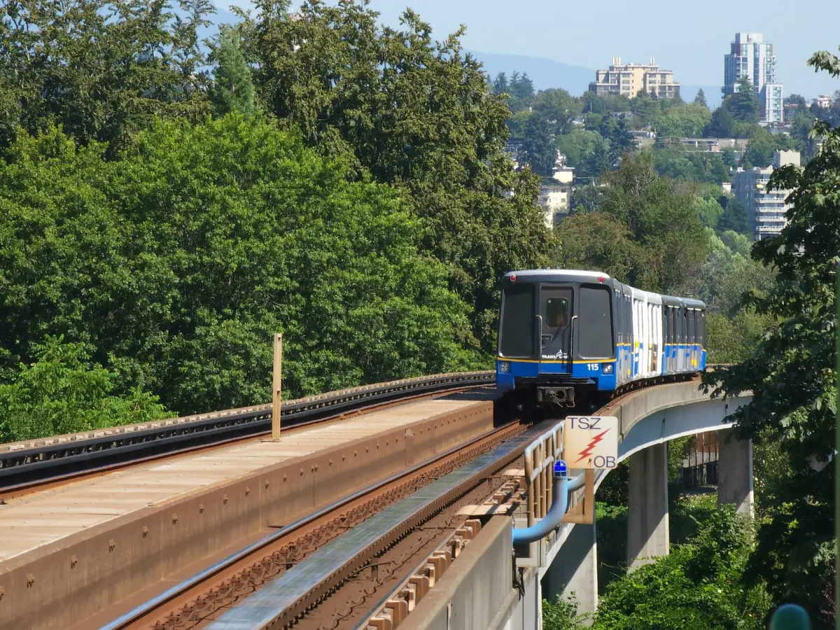 SkyTrain travelling on elevated tracks through Metro Vancouver